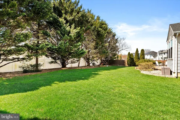 an aerial view of residential house with outdoor space and parking
