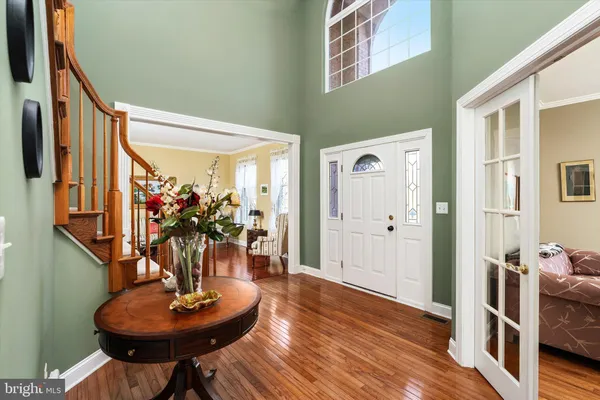 a view of a livingroom with furniture and hardwood floor