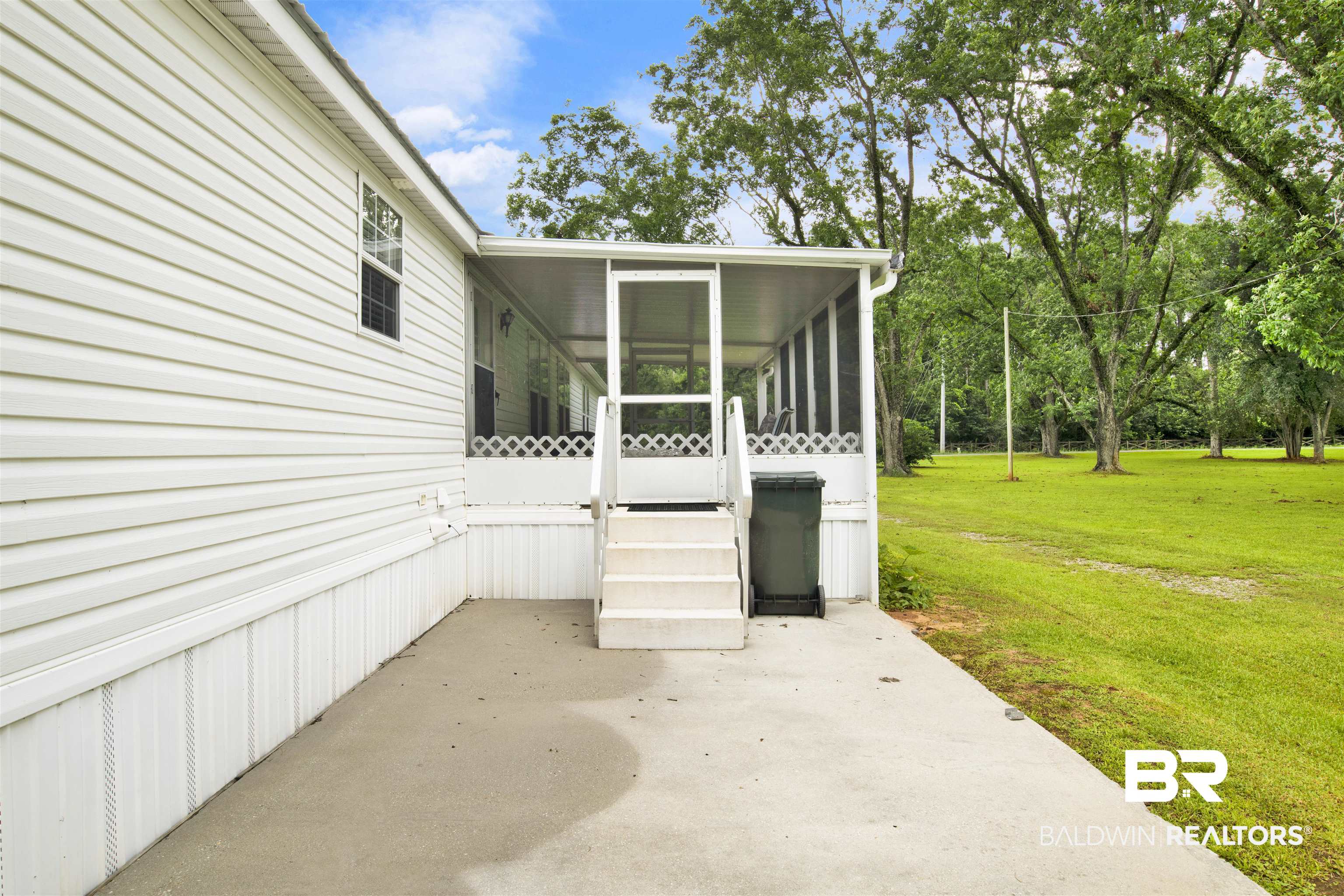 25700 County Road 71 Robertsdale, AL 36567 - Photo 30 of 40 View of patio featuring a sunroom