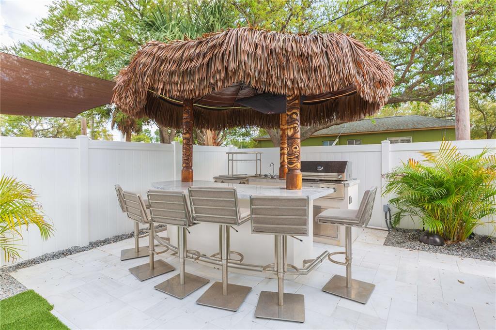 1304 West Arch Street Tampa, FL 33607 - Photo 11 of 75 a view of backyard with outdoor seating and green space