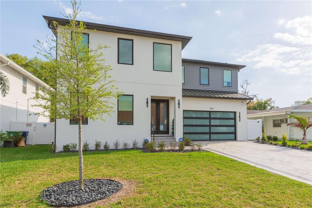 1304 West Arch Street Tampa, FL 33607 - Photo 2 of 75 a house view with a backyard space