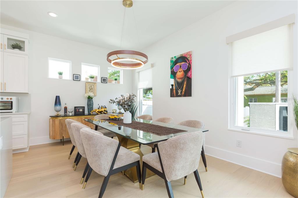 1304 West Arch Street Tampa, FL 33607 - Photo 24 of 75 a view of a dining room with furniture wooden floor and a window