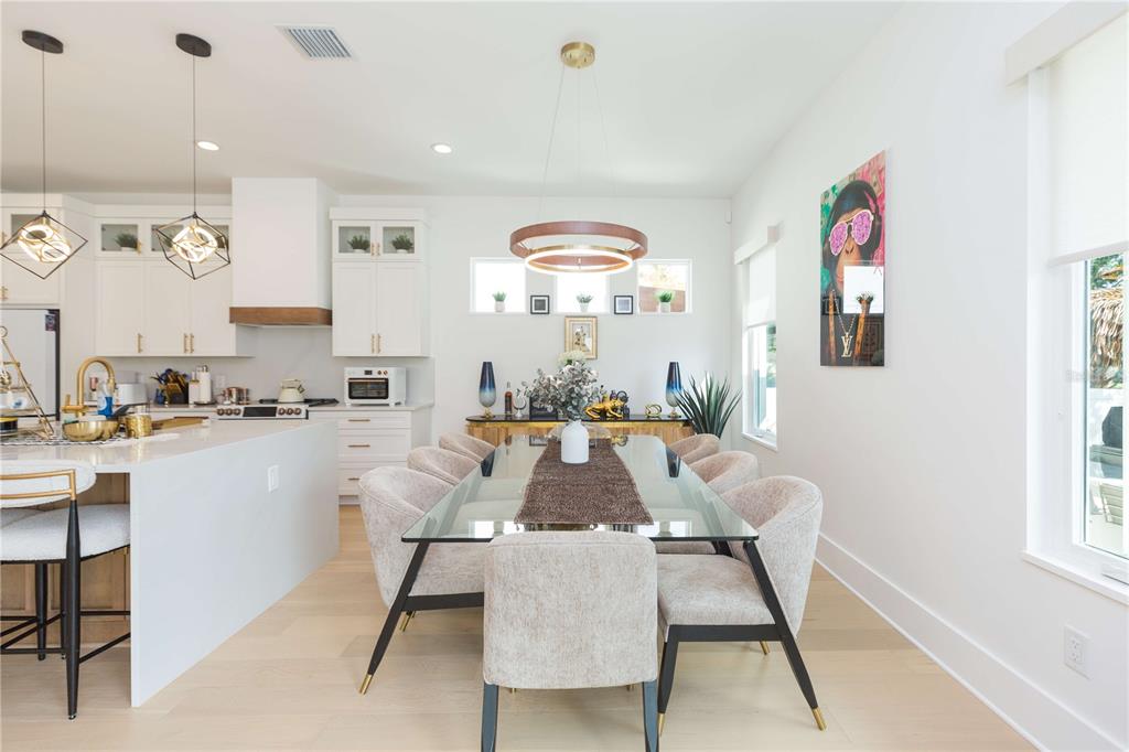 1304 West Arch Street Tampa, FL 33607 - Photo 25 of 75 a view of a dining room with furniture window and wooden floor