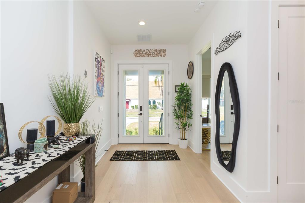1304 West Arch Street Tampa, FL 33607 - Photo 3 of 75 a view of a entryway door with wooden floor