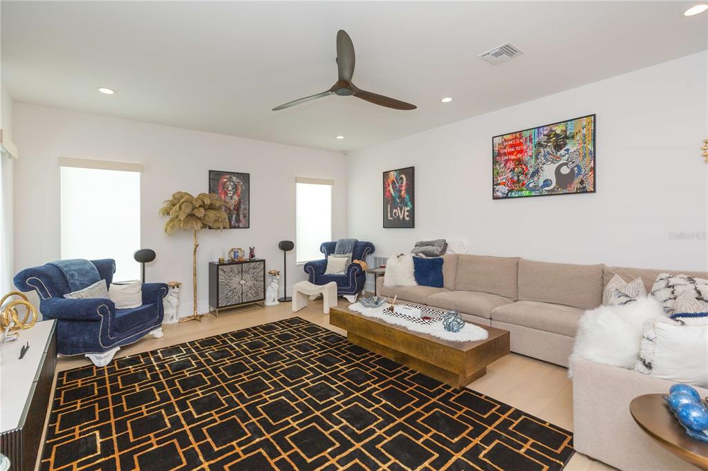1304 West Arch Street Tampa, FL 33607 - Photo 31 of 75 a living room with furniture and a rug