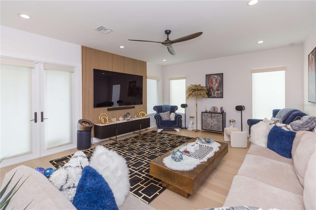 1304 West Arch Street Tampa, FL 33607 - Photo 32 of 75 a living room with furniture and a flat screen tv