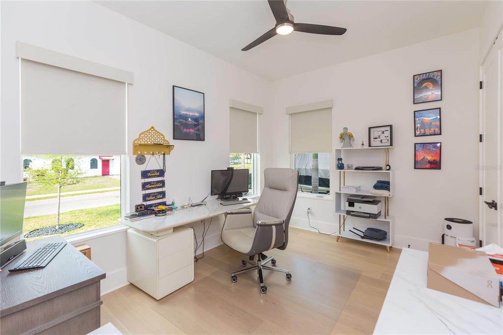 1304 West Arch Street Tampa, FL 33607 - Photo 36 of 75 a view of a workspace with furniture and a window