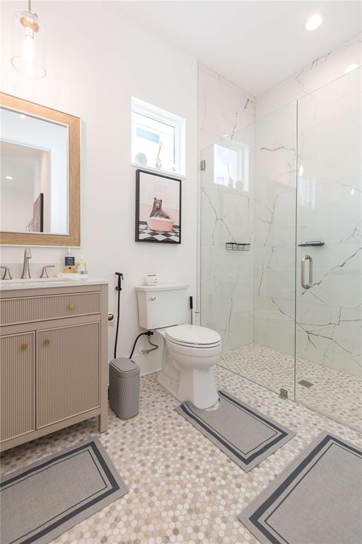 1304 West Arch Street Tampa, FL 33607 - Photo 39 of 75 a bathroom with a toilet sink and shower