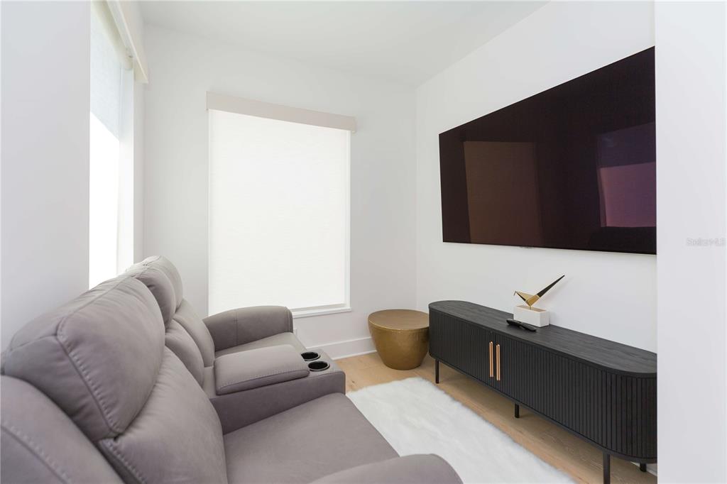 1304 West Arch Street Tampa, FL 33607 - Photo 40 of 75 a living room with furniture and a flat screen tv