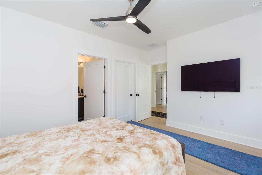 1304 West Arch Street Tampa, FL 33607 - Photo 49 of 75 a bedroom with a bed and a flat screen tv