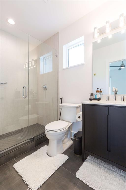 1304 West Arch Street Tampa, FL 33607 - Photo 52 of 75 a bathroom with a sink a toilet and shower