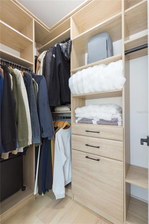 1304 West Arch Street Tampa, FL 33607 - Photo 57 of 75 a view of walk in closet with clothes and shoes