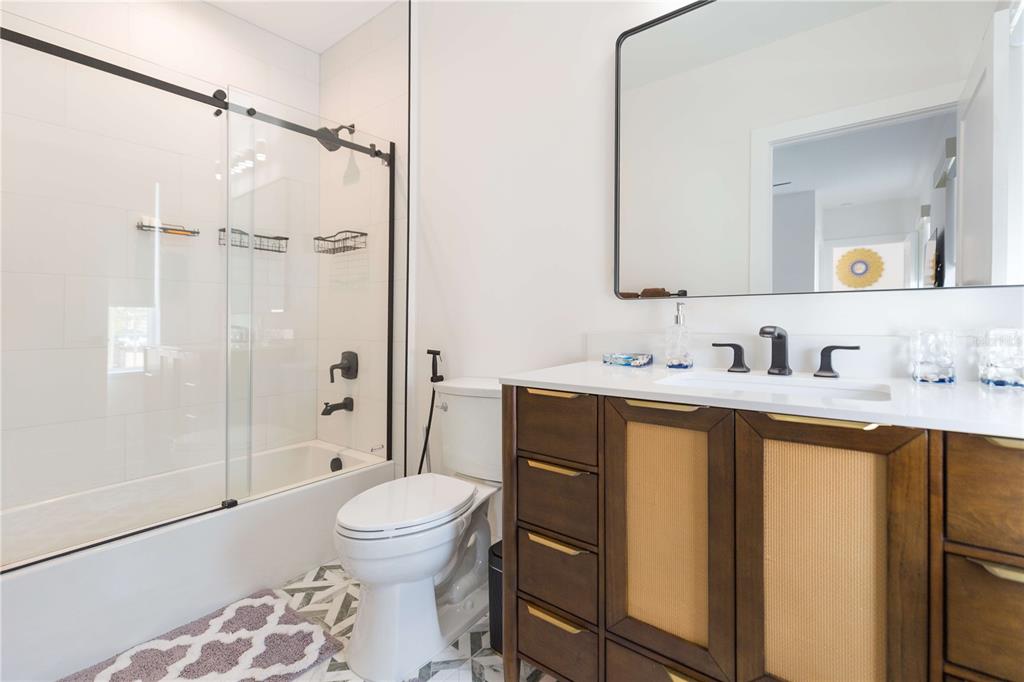 1304 West Arch Street Tampa, FL 33607 - Photo 58 of 75 a bathroom with a sink toilet and shower
