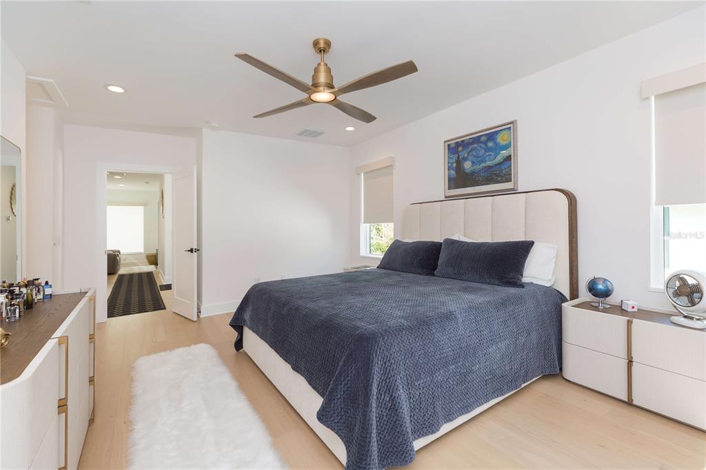 1304 West Arch Street Tampa, FL 33607 - Photo 62 of 75 a bedroom with a bed and a chandelier