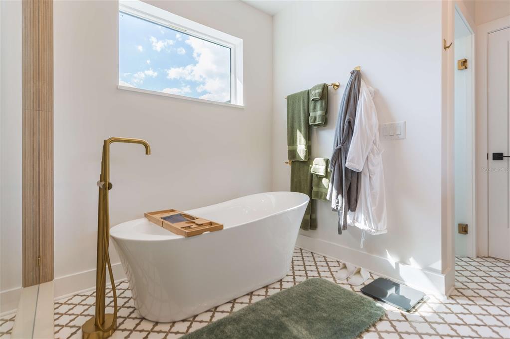 1304 West Arch Street Tampa, FL 33607 - Photo 66 of 75 a white bath tub sitting in a bathroom