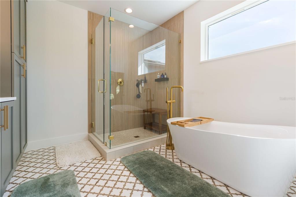 1304 West Arch Street Tampa, FL 33607 - Photo 67 of 75 a bathroom with a bathtub a toilet and a shower