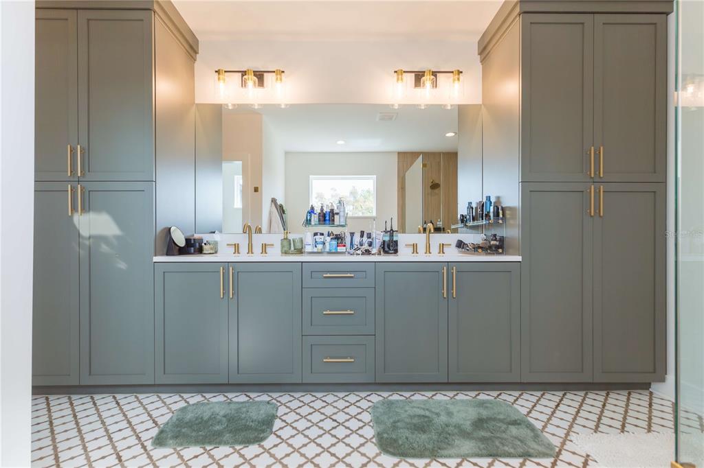 1304 West Arch Street Tampa, FL 33607 - Photo 68 of 75 a bathroom with a sink a mirror and a shower