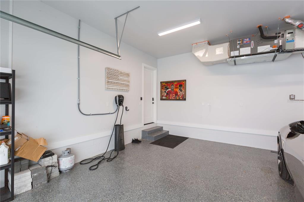 1304 West Arch Street Tampa, FL 33607 - Photo 72 of 75 a room with gym equipment and a view of living room