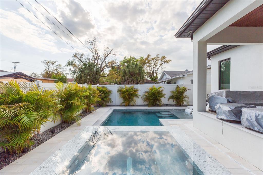 1304 West Arch Street Tampa, FL 33607 - Photo 9 of 75 a view of backyard with swimming pool and seating area