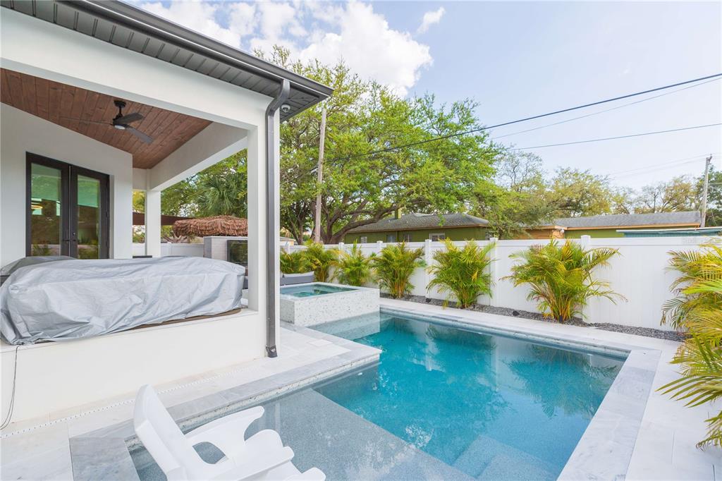 1304 West Arch Street Tampa, FL 33607 - Photo 10 of 75 a view of a swimming pool with a patio