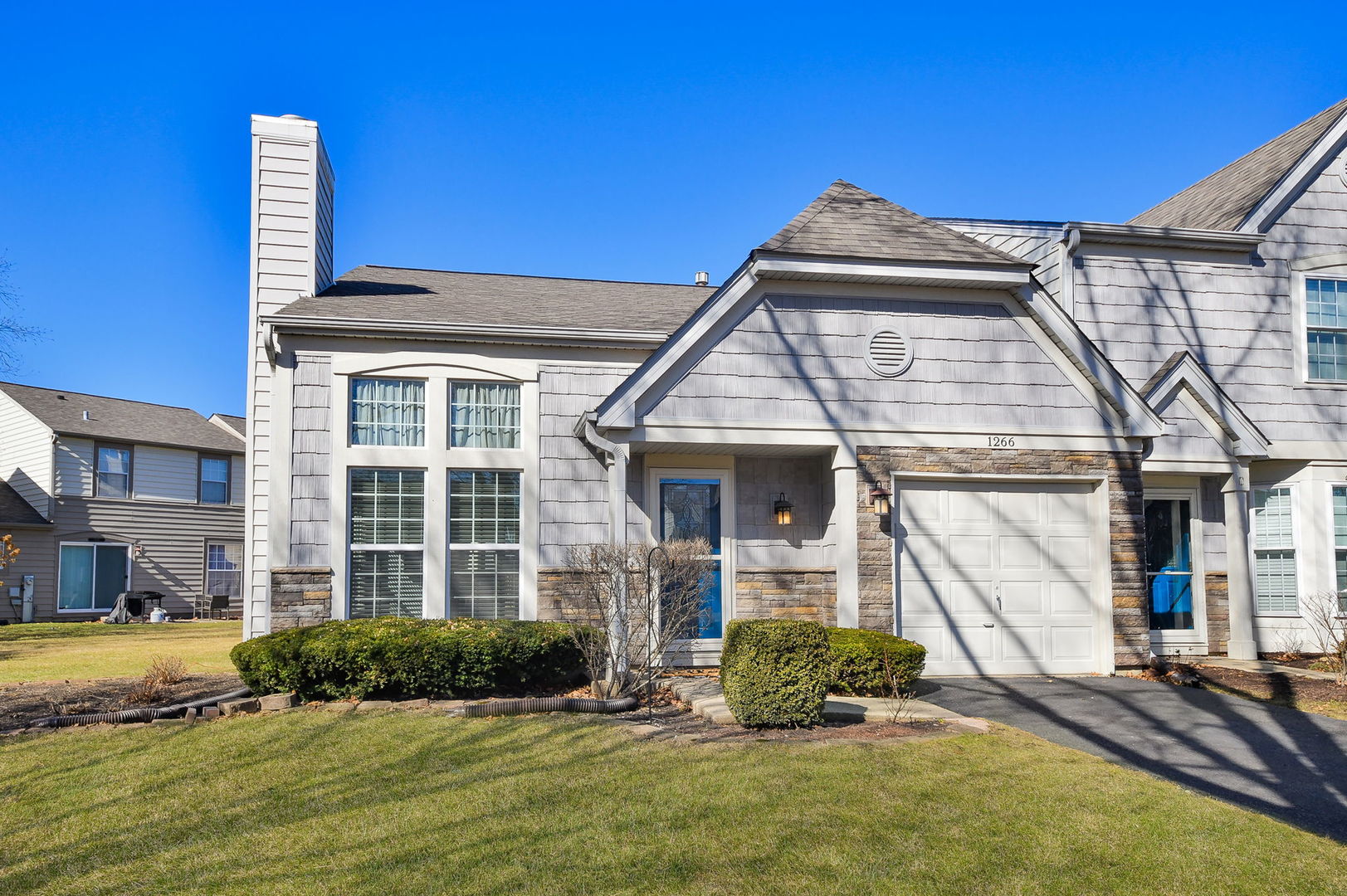 1266 Seabury Circle Carol Stream, IL 60188 - Photo 1 of 22 a front view of a house with a yard