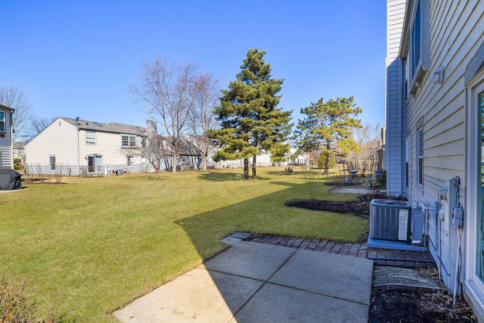 1266 Seabury Circle Carol Stream, IL 60188 - Photo 3 of 22 a view of a white house with a yard