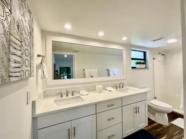 a bedroom with a bed and a floor to ceiling window