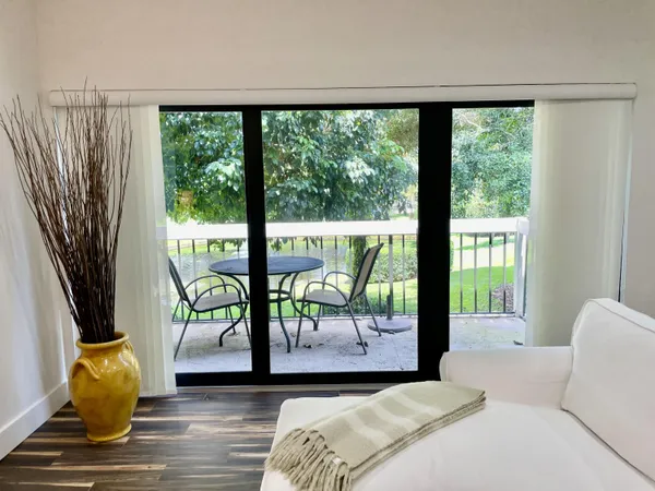 a view of a tree in a yard