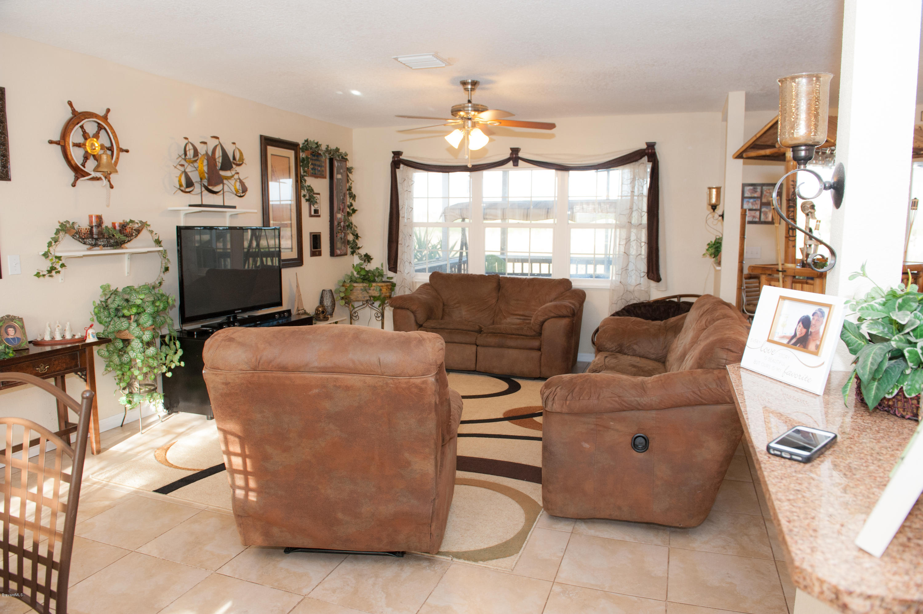 805 Mallard Road Cocoa, FL 32926 - Photo 9 of 18 Family room with water view-1