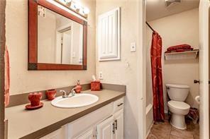 5626 Preston Oaks Road, Unit 39C Dallas, TX 75254 - Photo 36 of 38 Full bathroom with vanity, shower / tub combo with curtain, and light tile patterned floors