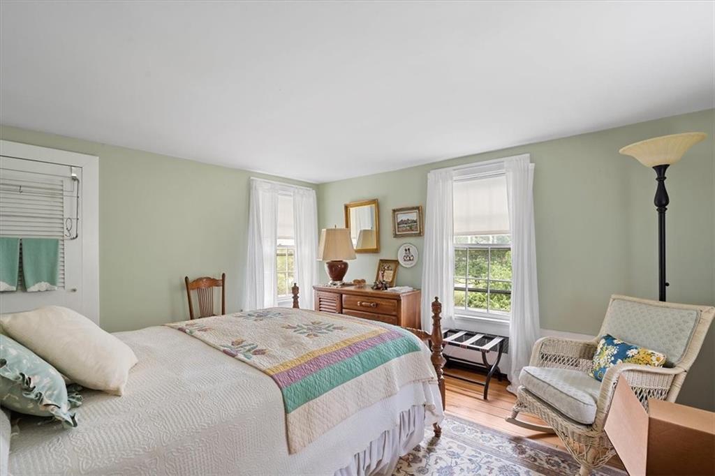 870 Field Club Road Pittsburgh, PA 15238 - Photo 14 of 19 a bedroom with a bed wooden floor and window