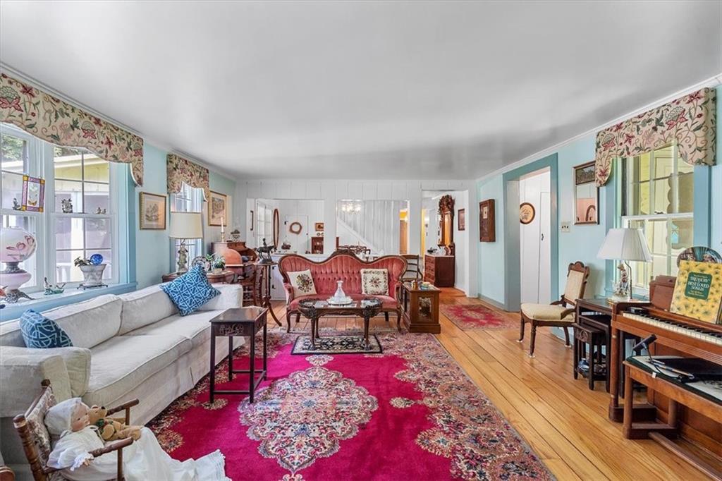 870 Field Club Road Pittsburgh, PA 15238 - Photo 7 of 19 a living room with furniture potted plant kitchen view and large windows