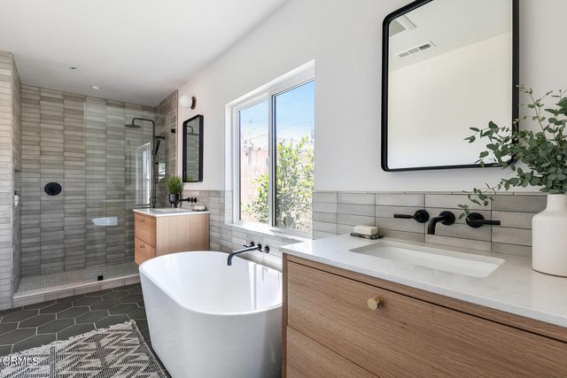 a bathroom with a bathtub and sink