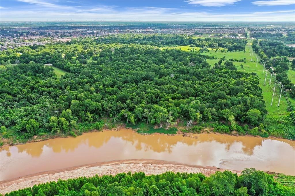 1950 Hagerson Road Sugar Land, TX 77479 - Photo 2 of 5 a view of a lake from a yard