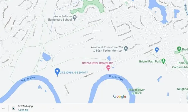 a view of a yard with large trees