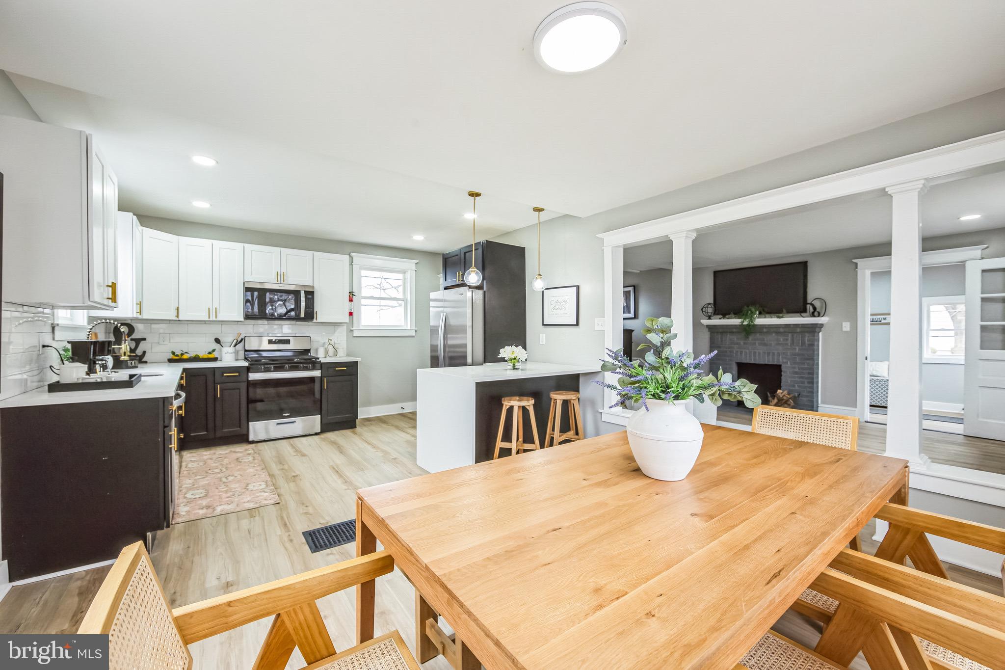 409 Neck Road Burlington, NJ 08016 - Photo 14 of 27 a large kitchen with a table and chairs