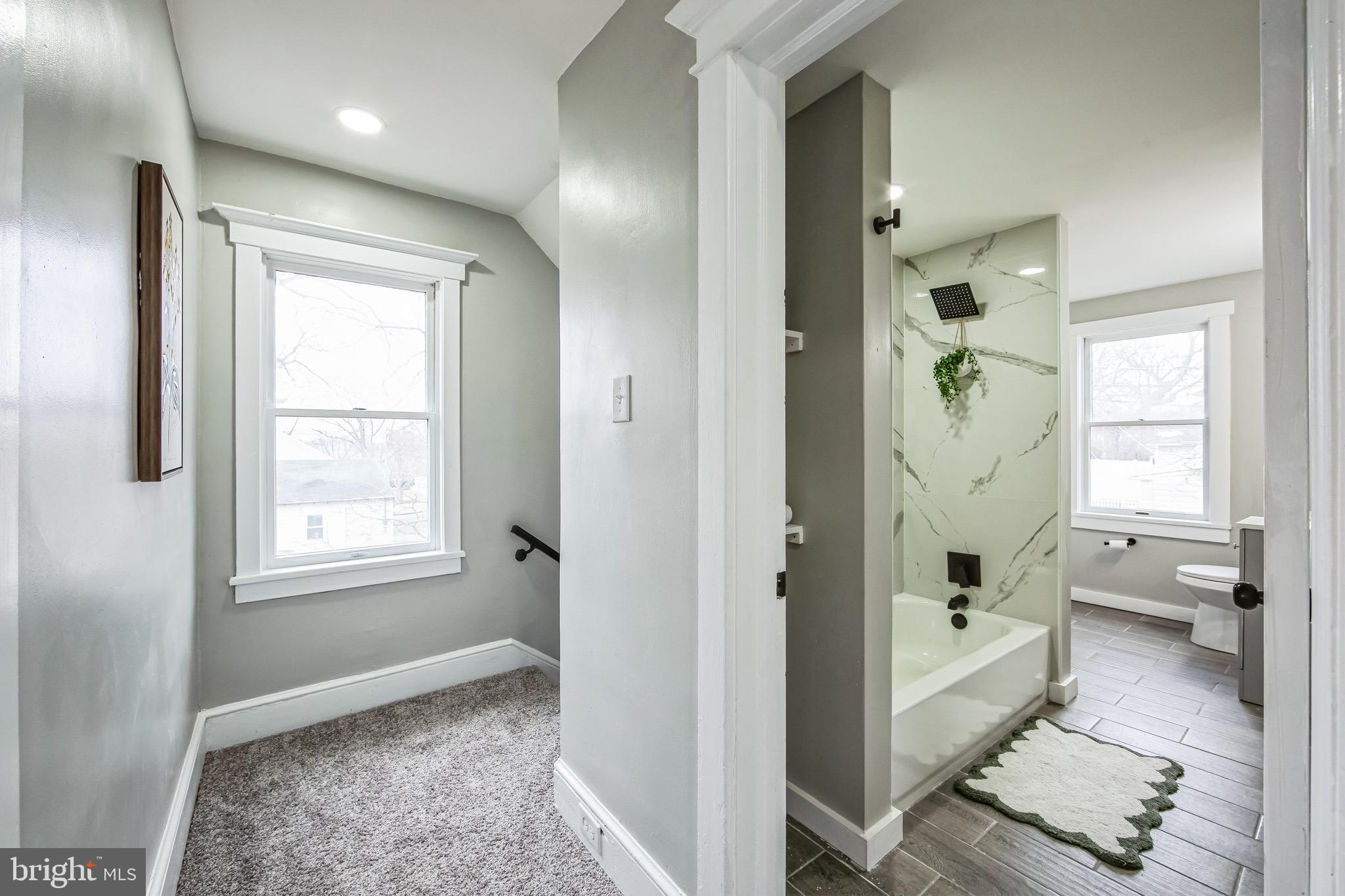 409 Neck Road Burlington, NJ 08016 - Photo 22 of 27 a bathroom with a tub shower and window