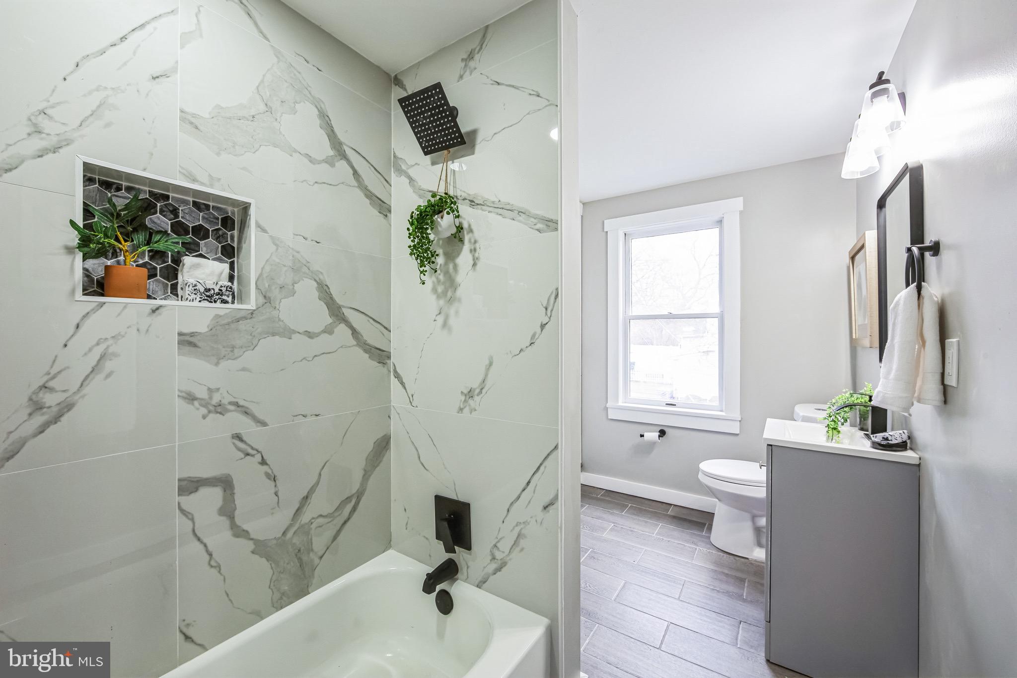 409 Neck Road Burlington, NJ 08016 - Photo 24 of 27 a bath room with a sink and a tub