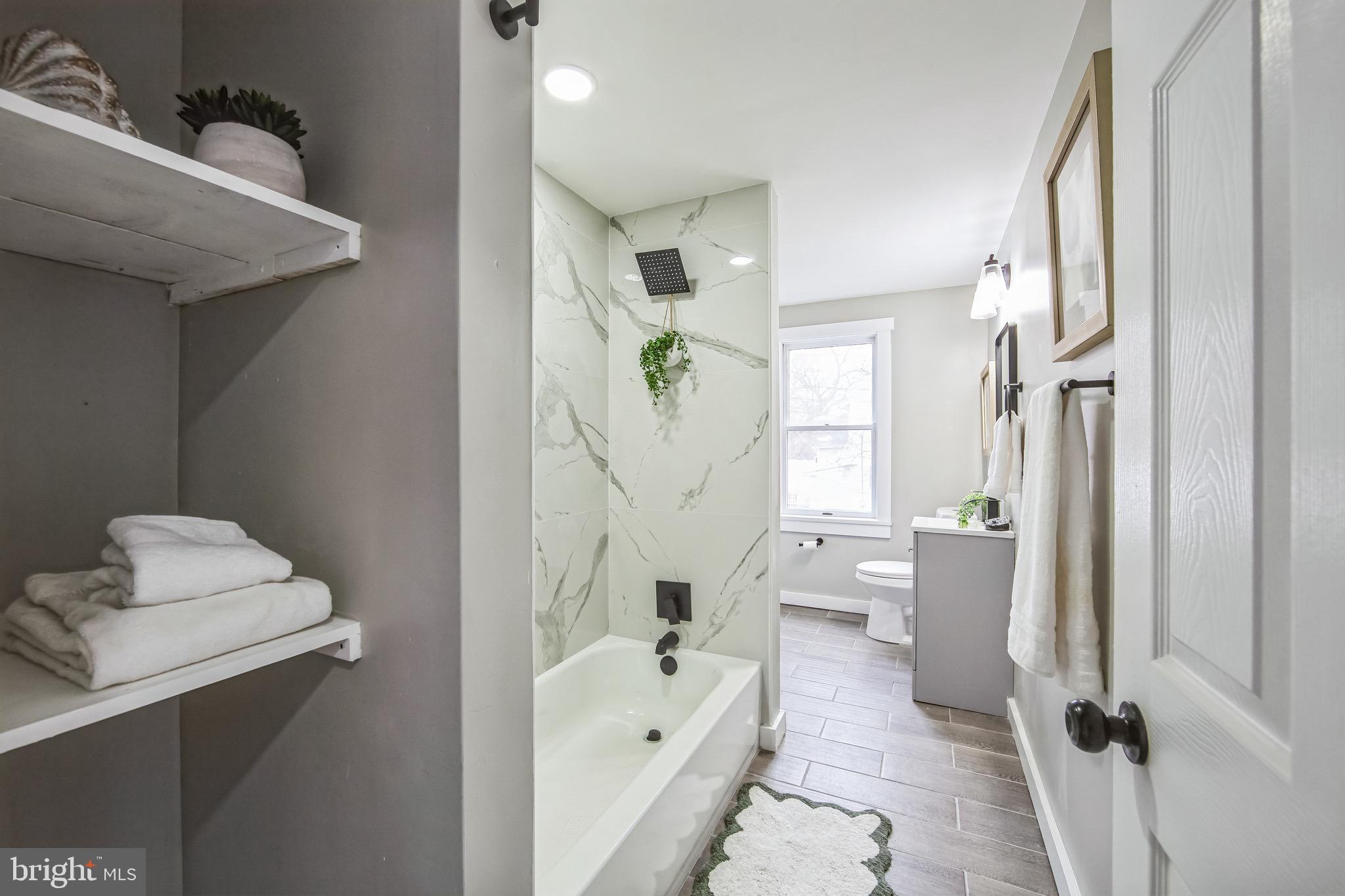 409 Neck Road Burlington, NJ 08016 - Photo 25 of 27 a bathroom with a bathtub sink and toilet