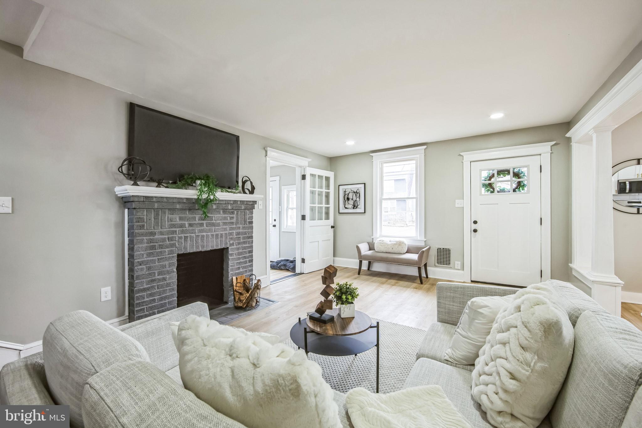 409 Neck Road Burlington, NJ 08016 - Photo 5 of 27 a living room with furniture fireplace and a flat screen tv