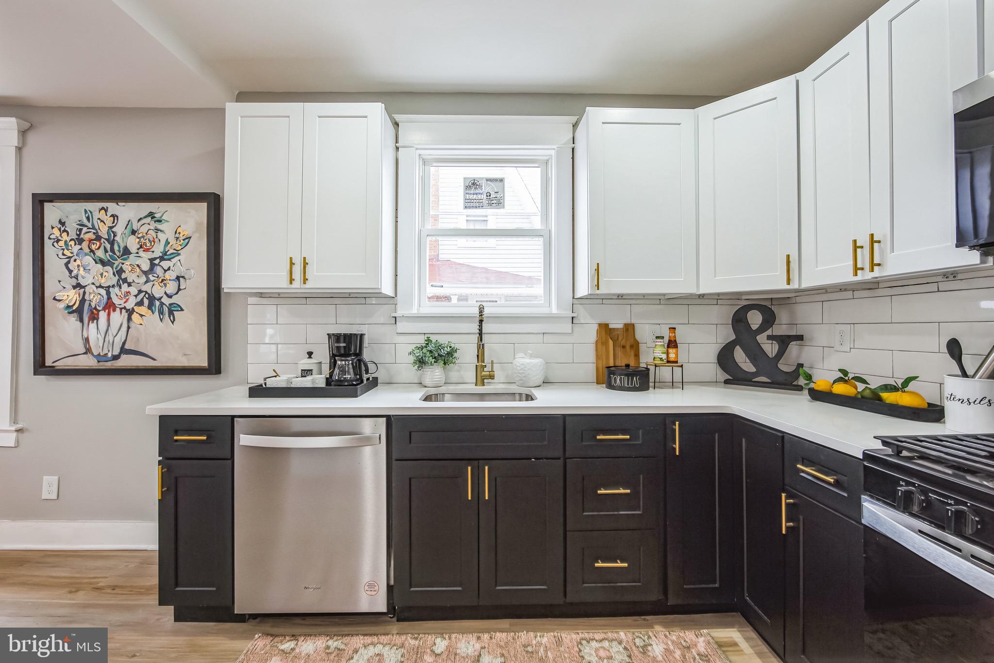 409 Neck Road Burlington, NJ 08016 - Photo 10 of 27 a kitchen with stainless steel appliances granite countertop a sink stove and cabinets