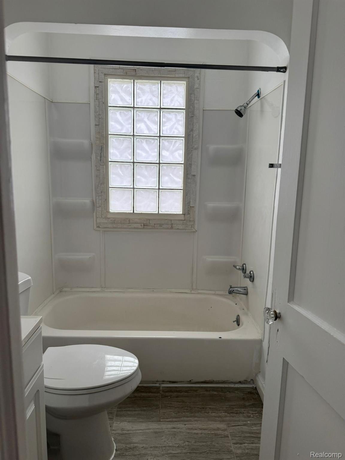 19706 Moross Road Detroit, MI 48224 - Photo 6 of 13 Bathroom featuring a full tub/shower combination with white surround