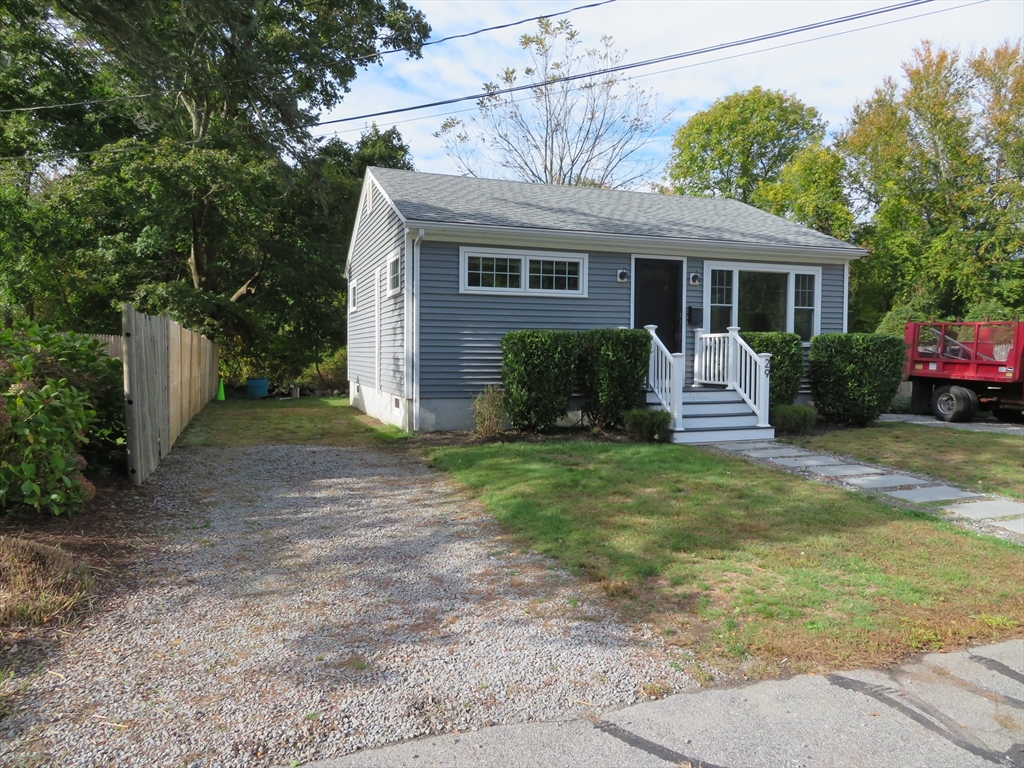 29 Davis Street Dartmouth, MA 02748 - Photo 2 of 12 a front view of house with a garden