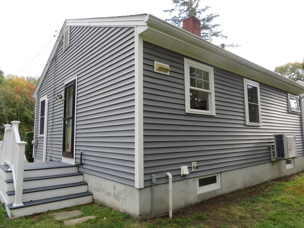 29 Davis Street Dartmouth, MA 02748 - Photo 3 of 12 a front view of a house with a garage