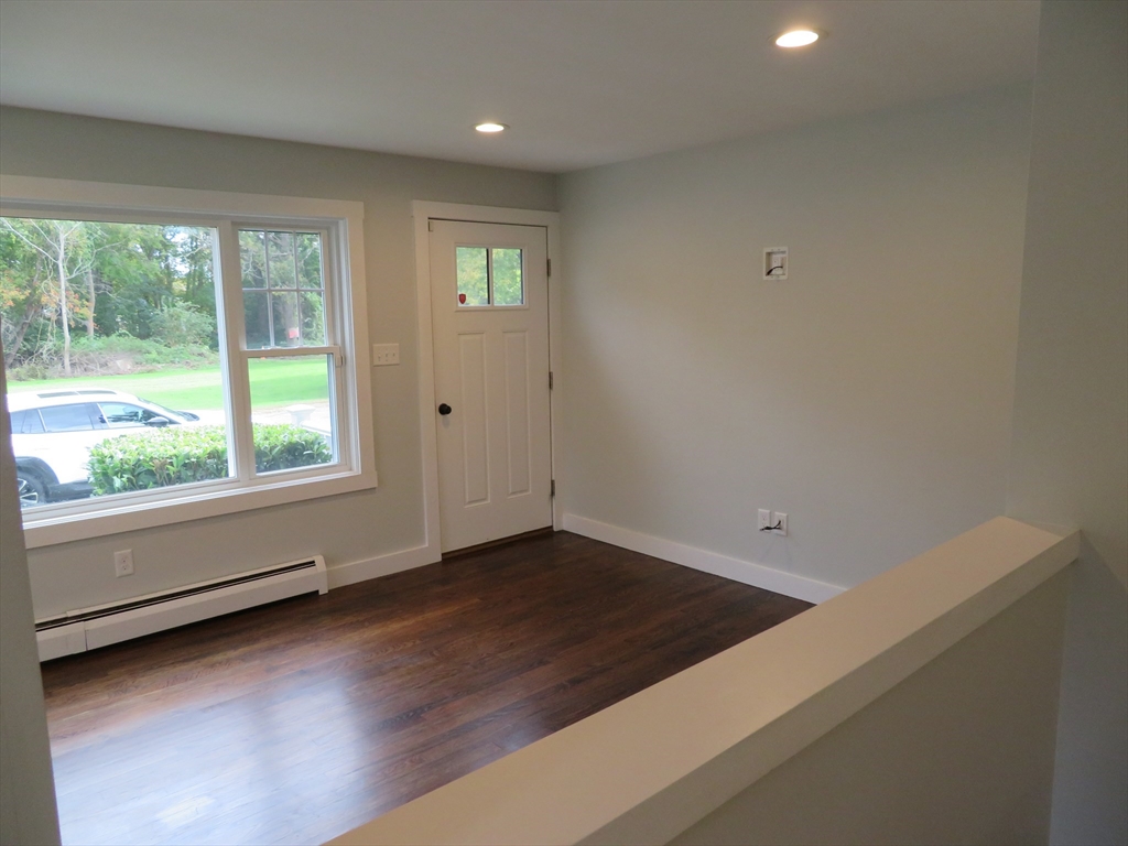 29 Davis Street Dartmouth, MA 02748 - Photo 5 of 12 an empty room with wooden floor and windows