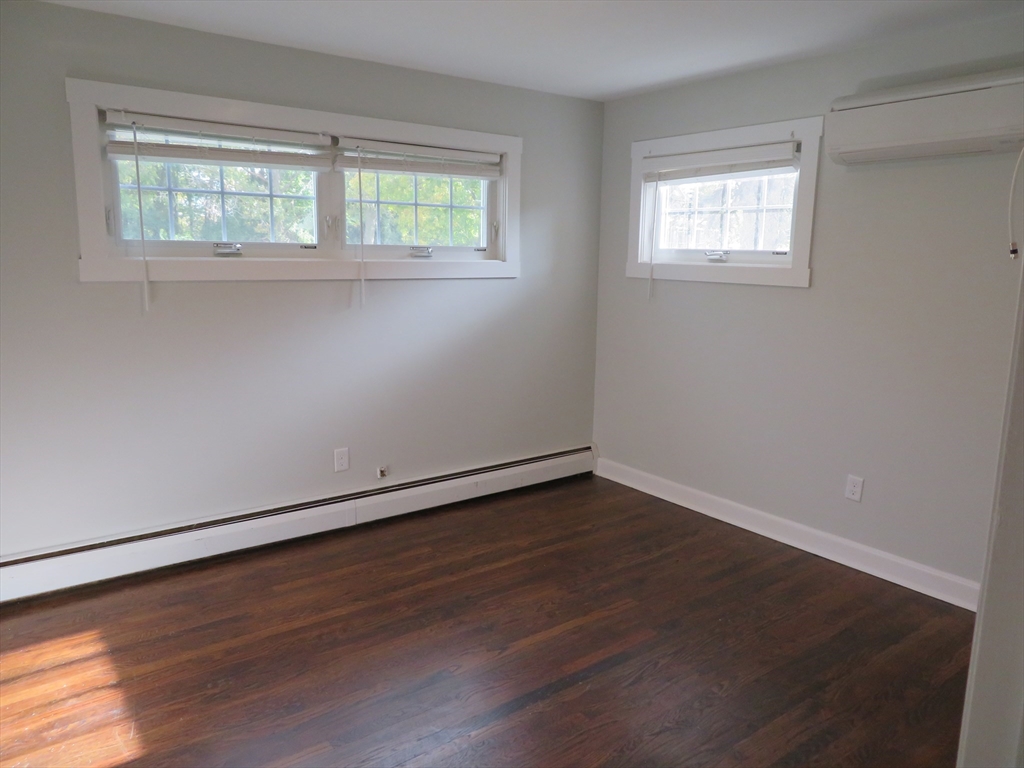 29 Davis Street Dartmouth, MA 02748 - Photo 9 of 12 an empty room with wooden floor and windows