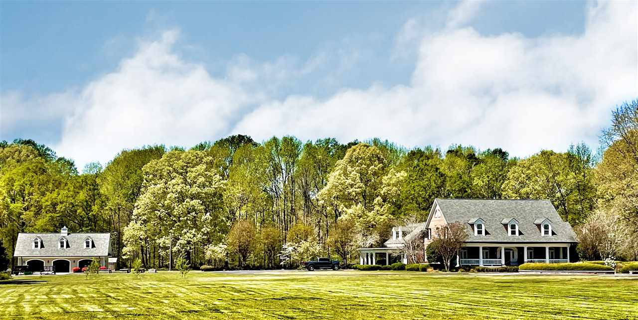 500 Eden Brooke Farm Road Bells, TN 38006 - Photo 1 of 19 a front view of a house with a garden