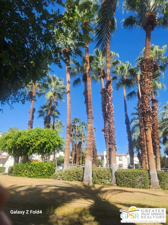 401 El Cielo Road, Unit 93 Palm Springs, CA 92262 - Photo 13 of 17 front view of a house with a yard