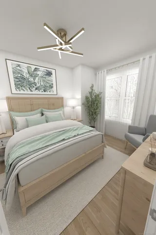 a bedroom with a large bed and a window