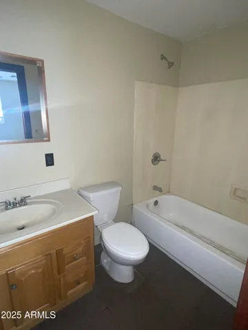 a bathroom with a sink a toilet and bathtub